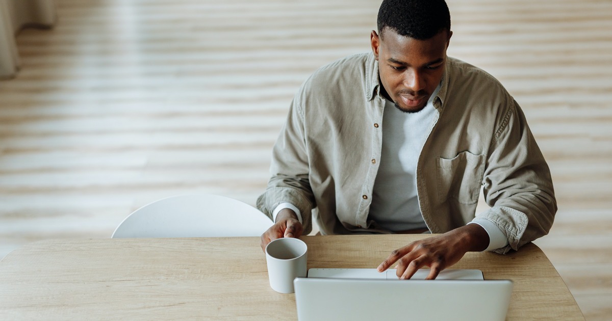 Writer typing on a laptop