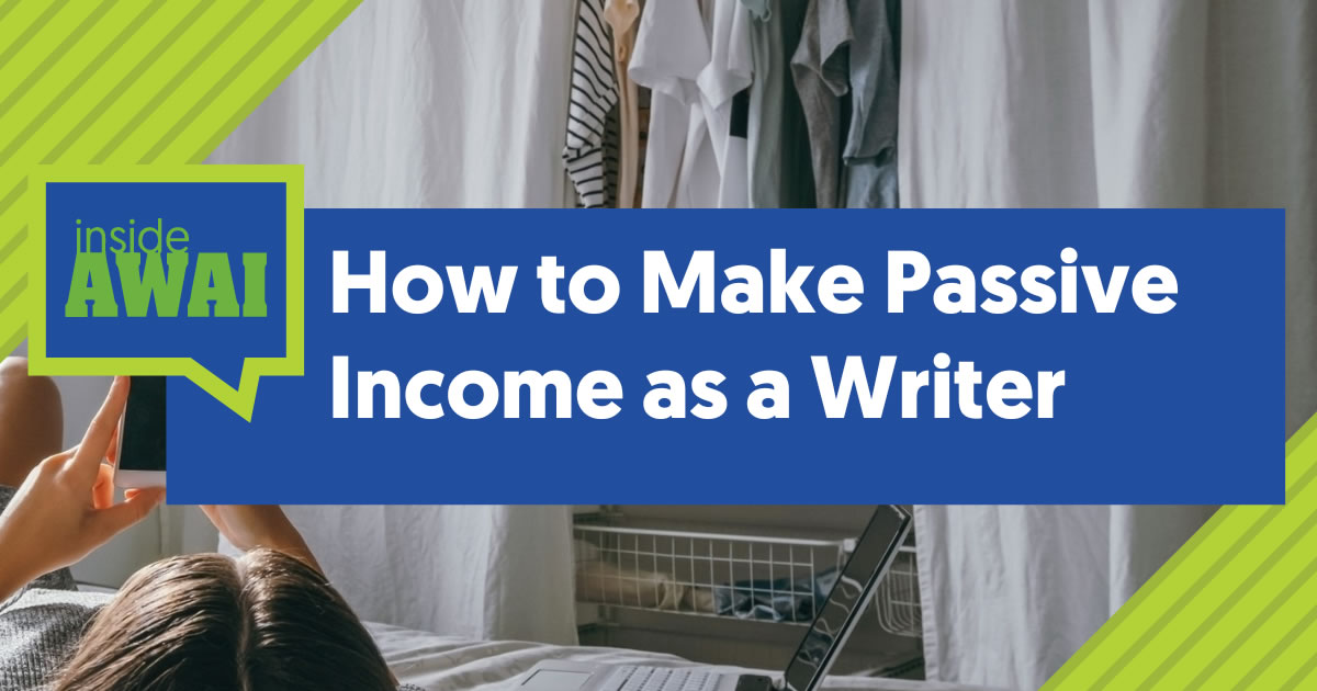 Person on their bed using mobile phone next to laptop